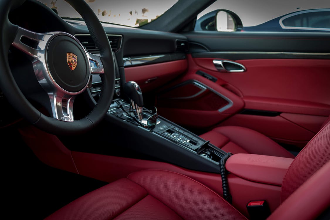 Noah Chemicals is your single source for both traditional and custom chemical products. the interior of a porche car with red seats