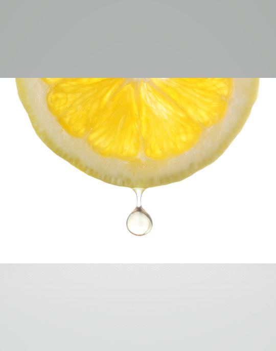 citric acid dripping off of a lemon slice