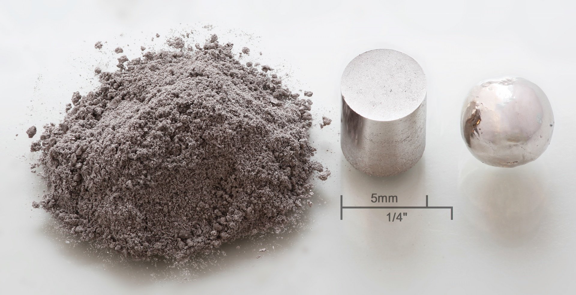 3 different types of one element, ground up to a powder, a flat cylinder, and a sphere