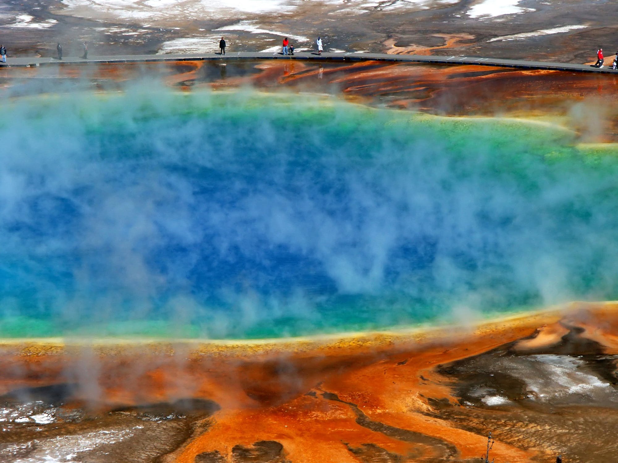 sulfur pool of many colors with sulfuric vapors